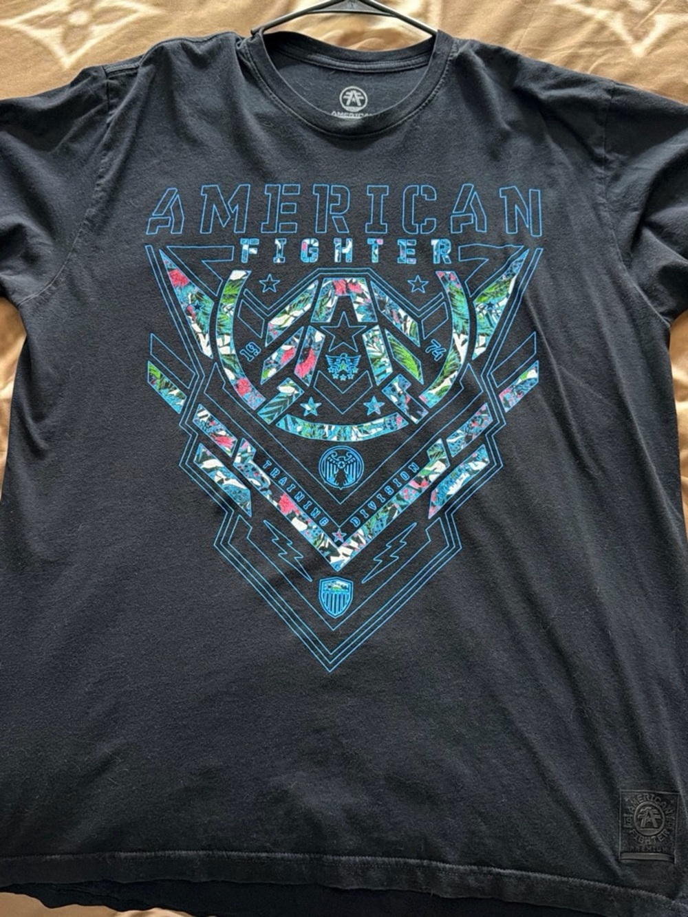 American Fighter Black Graphic Tee with Blue & Multicolor Floral Accents